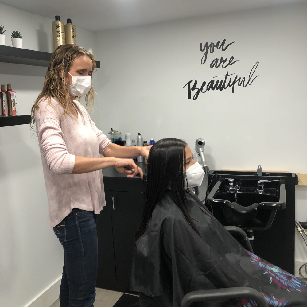emily cutting hair in mask
